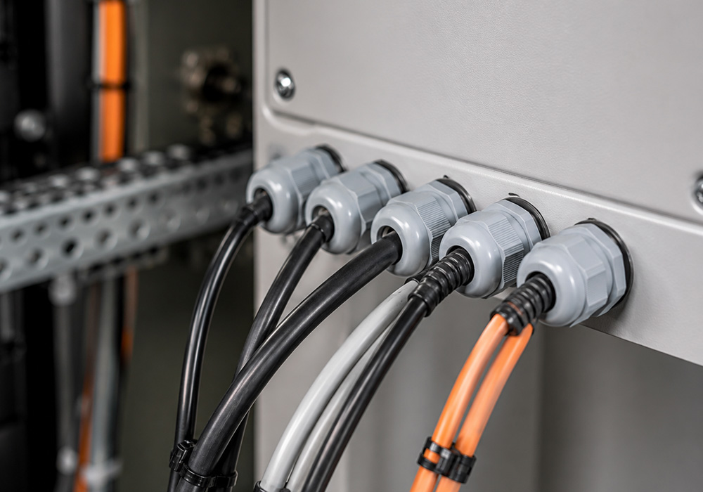 Industrial cable glands installed in an electrical enclosure